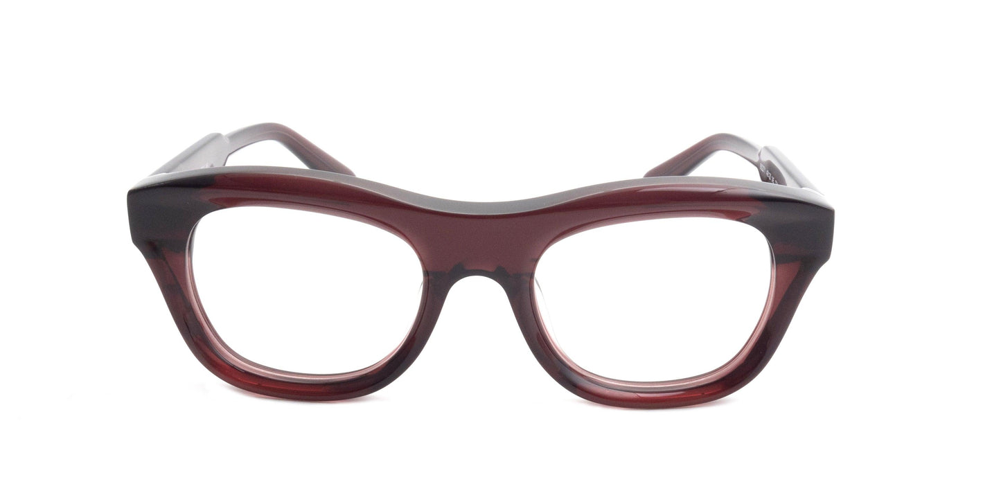 Thick-rimmed dark red oval eyeglass frames with a bold bridge