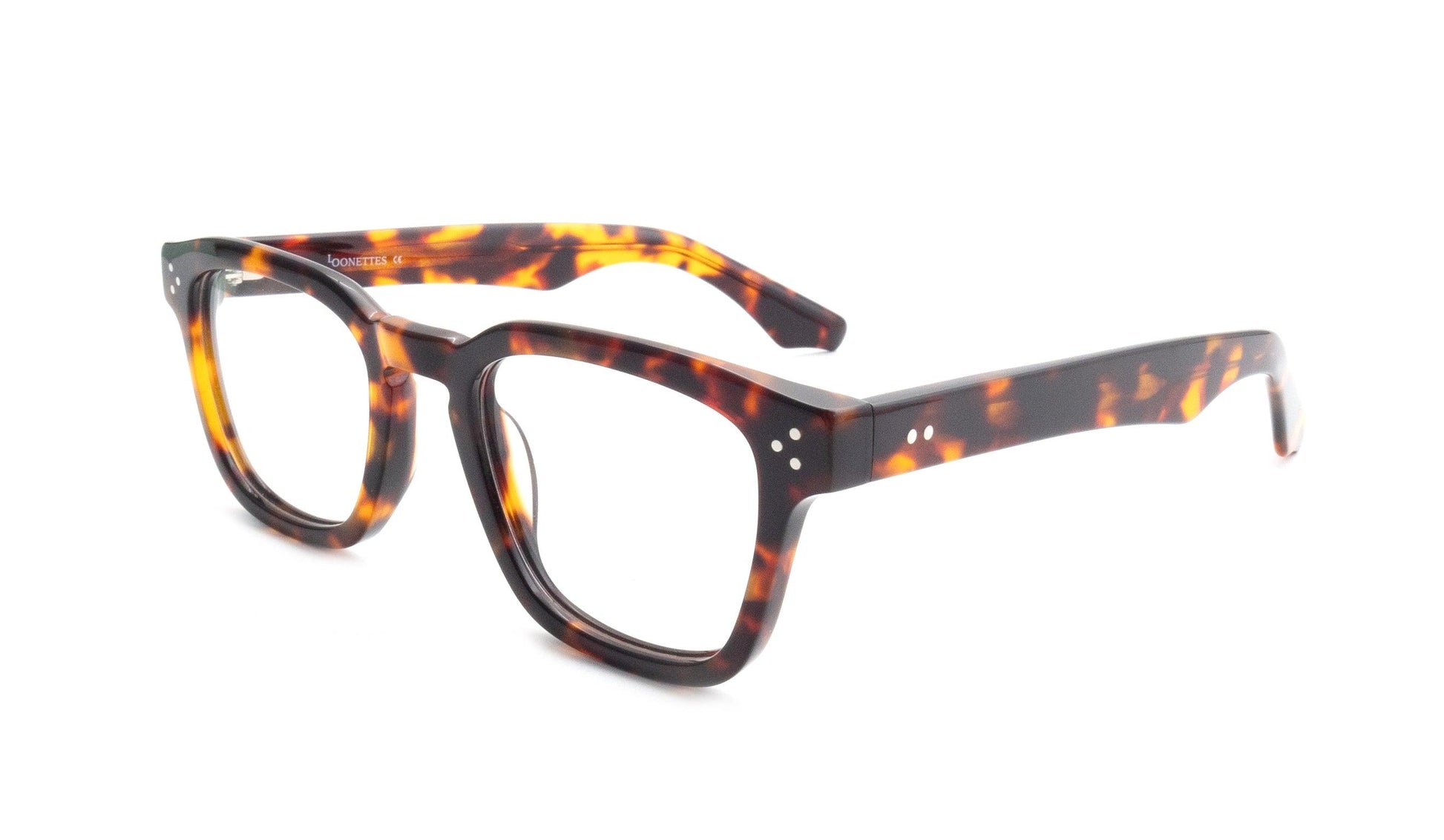 Bold tortoiseshell eyeglasses with square lenses and silver rivet details on the frame front and temples.