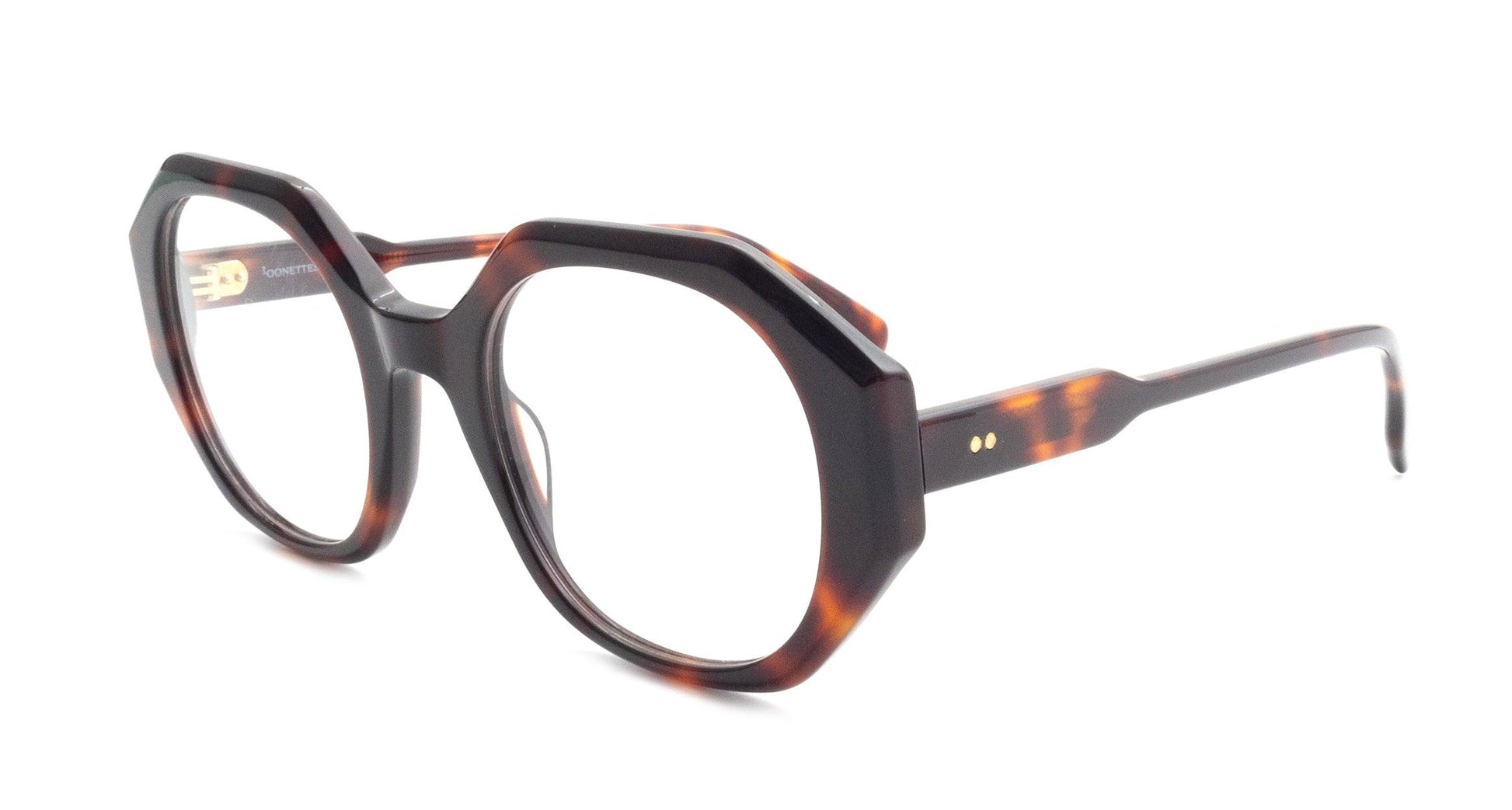 Bold tortoiseshell eyeglasses with geometric frame design for modern eyewear fashion and optical style.
